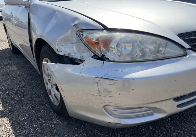 Uploaded photo of collision damage, front quarter panel
